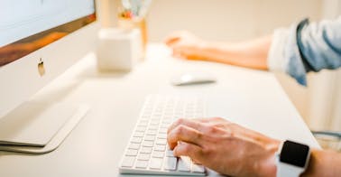 Hands on computer to write a follow up email