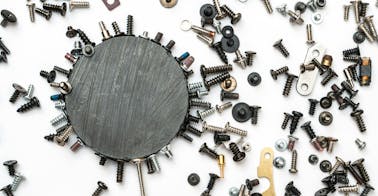 Nuts and bolts representing AI-powered skills-based learning.