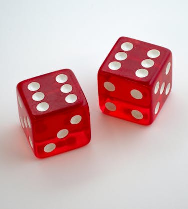 Double-six rolled on red dice representing the twelve best learning and development tools in 2024.